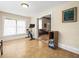 Exercise room with a stationary bike, window, and view into living area at 606 Howell Ave, Brooksville, FL 34601