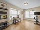 Bright exercise room featuring a bench, large windows, and an exercise bike at 606 Howell Ave, Brooksville, FL 34601