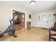 Bright foyer featuring neutral tile floors, a white front door, and an open doorway to the living area at 606 Howell Ave, Brooksville, FL 34601