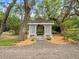 Beautiful gazebo situated amongst mature trees offering a peaceful retreat in the backyard at 606 Howell Ave, Brooksville, FL 34601