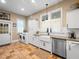 Well-appointed kitchen includes modern appliances, farmhouse sink, and nearby laundry at 606 Howell Ave, Brooksville, FL 34601