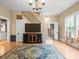 Inviting living room showcasing hardwood floors, comfortable seating, decorative rug, and an abundance of natural light at 606 Howell Ave, Brooksville, FL 34601