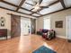 Living area with a couch, barn doors, and hardwood floors at 606 Howell Ave, Brooksville, FL 34601