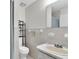 Bright bathroom with a white tiled shower, vanity, and modern fixtures at 6219 Wilds Dr # 11A, New Port Richey, FL 34653
