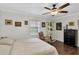 Relaxing bedroom with ample natural light, hardwood floors, and a cozy reading corner at 6219 Wilds Dr # 11A, New Port Richey, FL 34653