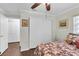 Well-lit bedroom featuring hardwood floors, a closet, and neutral decor at 6219 Wilds Dr # 11A, New Port Richey, FL 34653