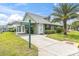 Well-manicured lawn and a charming exterior view of this single-story home at 6219 Wilds Dr # 11A, New Port Richey, FL 34653