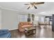 Open-concept living room with dining area and hardwood floors at 6219 Wilds Dr # 11A, New Port Richey, FL 34653