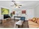 Comfortable living room with hardwood floors, ample natural light, and tasteful decor at 6219 Wilds Dr # 11A, New Port Richey, FL 34653