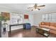 Bright living room featuring hardwood floors, natural light, and a cozy atmosphere at 6219 Wilds Dr # 11A, New Port Richey, FL 34653