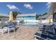 Community pool with lounge chairs and a well-kept patio area at 6219 Wilds Dr # 11A, New Port Richey, FL 34653