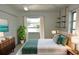 Bedroom with modern decor, natural light, and wooden accents at 6327 Skyline Ct, Spring Hill, FL 34606