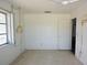 Bright bedroom features a large window that provides natural light to the neutral colored walls and ceiling fan at 6327 Skyline Ct, Spring Hill, FL 34606