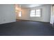 Empty room with carpet and large windows at 6327 Skyline Ct, Spring Hill, FL 34606
