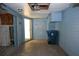 Here's an empty blue walled garage with cabinets at 6327 Skyline Ct, Spring Hill, FL 34606