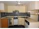 Kitchen features ample cabinet space, tile backsplash, range, and sink at 6327 Skyline Ct, Spring Hill, FL 34606