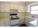 White kitchen with essential appliances at 6327 Skyline Ct, Spring Hill, FL 34606