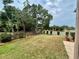 Fenced backyard features well-maintained lawn with lush landscaping for outdoor enjoyment at 6338 Spring Flower Dr # 15, New Port Richey, FL 34653