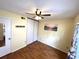 Bright bedroom includes closet, beach themed picture, and ceiling fan at 6338 Spring Flower Dr # 15, New Port Richey, FL 34653
