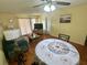 Cozy dining area with hardwood floors and a ceiling fan for added comfort at 6338 Spring Flower Dr # 15, New Port Richey, FL 34653