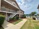 Beautiful condo with well-manicured lawn, white picket fence and convenient stairway access at 6338 Spring Flower Dr # 15, New Port Richey, FL 34653
