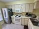 Efficient kitchen with stainless steel refrigerator and modern appliances at 6338 Spring Flower Dr # 15, New Port Richey, FL 34653