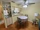 Kitchen and dining area, with ceiling fan, for convenient cooking and dining at 6338 Spring Flower Dr # 15, New Port Richey, FL 34653