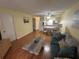 Bright living room featuring hardwood floors and seamless flow into the dining area at 6338 Spring Flower Dr # 15, New Port Richey, FL 34653
