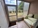 Enclosed patio with tiled floor and cushioned seating at 6338 Spring Flower Dr # 15, New Port Richey, FL 34653