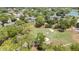 Scenic aerial view of community beside golf course, lush greenery, and trees at 7644 St Andrews Blvd # 0, Weeki Wachee, FL 34613