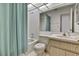 This bathroom features shower and tub combo, white tile surround, and mirrored vanity at 7644 St Andrews Blvd # 0, Weeki Wachee, FL 34613