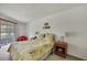 Bright bedroom with large window, carpet, and floral bedding at 7644 St Andrews Blvd # 0, Weeki Wachee, FL 34613
