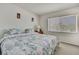 Serene bedroom with a bed, large window for natural light, and soft, neutral colors at 7644 St Andrews Blvd # 0, Weeki Wachee, FL 34613