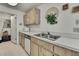 Functional kitchen featuring light wood cabinets, stainless steel sink and basic appliances at 7644 St Andrews Blvd # 0, Weeki Wachee, FL 34613