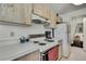 Functional kitchen featuring light wood cabinets, white countertops and basic appliances at 7644 St Andrews Blvd # 0, Weeki Wachee, FL 34613
