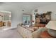 Inviting living room with neutral decor, adjacent to a dining area and sliding glass doors at 7644 St Andrews Blvd # 0, Weeki Wachee, FL 34613