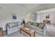 A cozy living room featuring neutral colored couches and a bright airy ambiance at 7644 St Andrews Blvd # 0, Weeki Wachee, FL 34613
