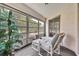 Comfortable sun room with lounge chairs and view of a green yard at 7644 St Andrews Blvd # 0, Weeki Wachee, FL 34613