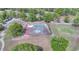 Aerial image showcasing tennis courts, surrounded by lush trees and greenery at 7662 St Andrews Blvd, Weeki Wachee, FL 34613