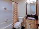 Traditional bathroom with tile shower and vanity with storage, showcasing its classic appeal at 7662 St Andrews Blvd, Weeki Wachee, FL 34613