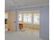 Bedroom featuring an open doorway to another room, a ceiling fan, and neutral patterned carpet at 7662 St Andrews Blvd, Weeki Wachee, FL 34613