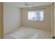 Bright bedroom with neutral carpet and a window offering soft natural light at 7662 St Andrews Blvd, Weeki Wachee, FL 34613