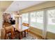 Dining Room features a chandelier and a wall of windows letting in natural light at 7662 St Andrews Blvd, Weeki Wachee, FL 34613