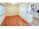 Sunlit dining room featuring laminate floors and a view of the kitchen at 7662 St Andrews Blvd, Weeki Wachee, FL 34613