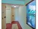 Bright entryway with laminate floors, and natural light from the window at 7662 St Andrews Blvd, Weeki Wachee, FL 34613