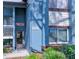 Close-up of a charming condo showcasing lush landscaping and a textured facade at 7662 St Andrews Blvd, Weeki Wachee, FL 34613