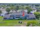 A lovely aerial shot showcases a backyard with a lush lawn and plenty of space for entertaining at 7662 St Andrews Blvd, Weeki Wachee, FL 34613