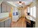 Inviting kitchen featuring granite countertops, custom cabinets, and hardwood floors at 7662 St Andrews Blvd, Weeki Wachee, FL 34613