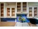 Kitchen sink featuring a double basin, solid countertop, and tile backsplash at 7662 St Andrews Blvd, Weeki Wachee, FL 34613