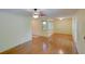 Spacious living room with laminate floors and neutral walls at 7662 St Andrews Blvd, Weeki Wachee, FL 34613
